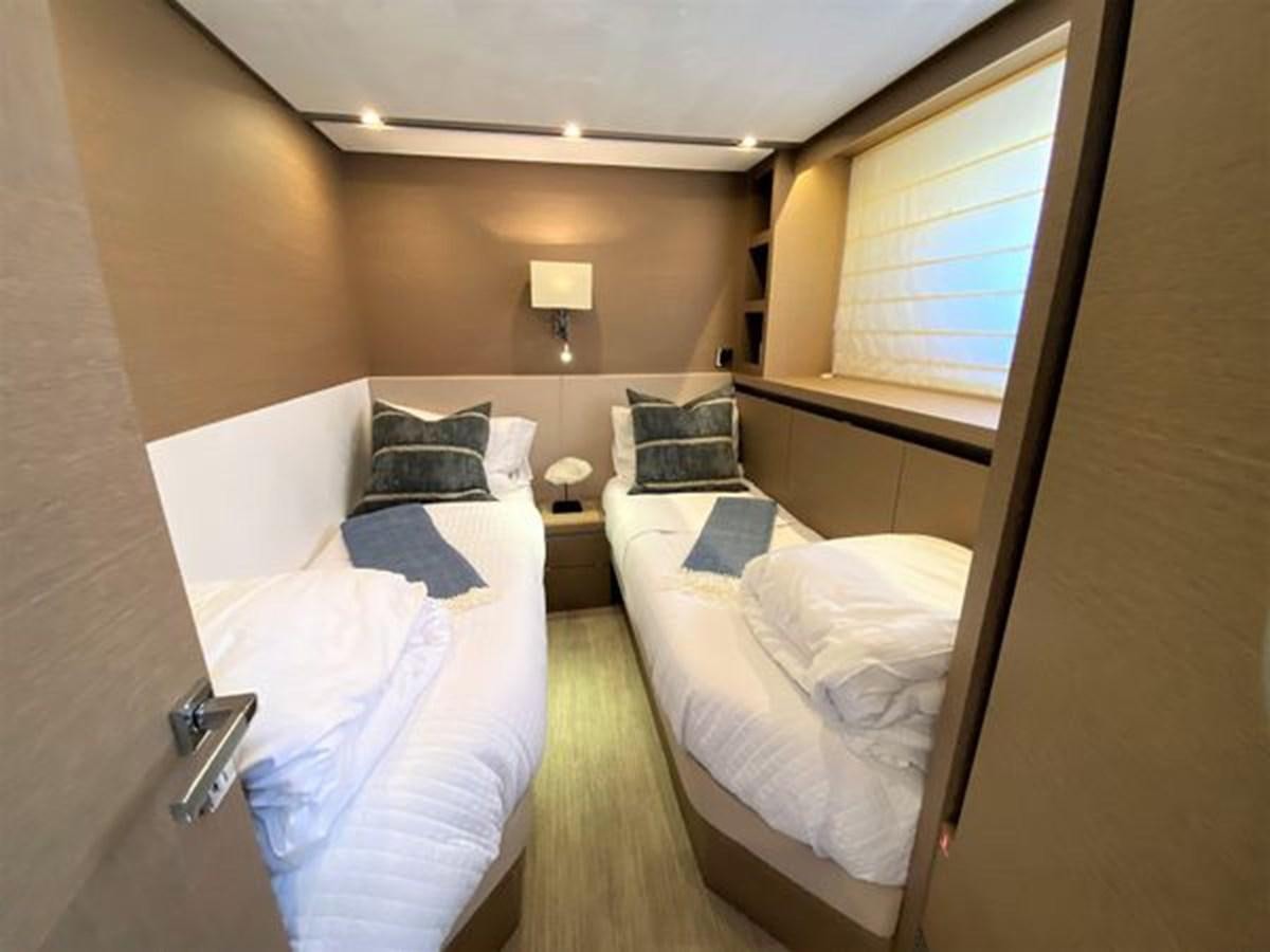 a couple of beds in a hotel room aboard 2016 PRESTIGE 680 FLY Yacht for Sale