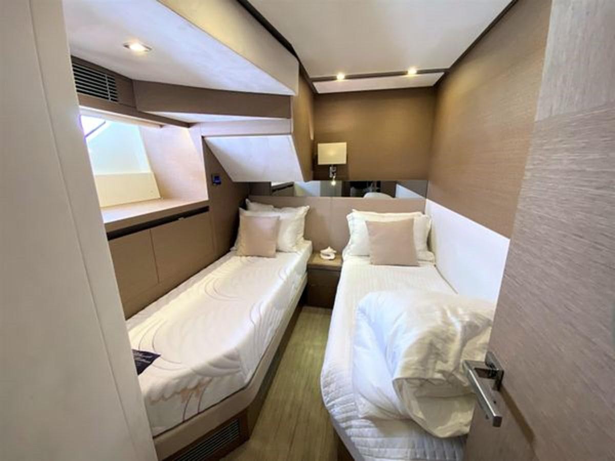 a room with two beds aboard 2016 PRESTIGE 680 FLY Yacht for Sale