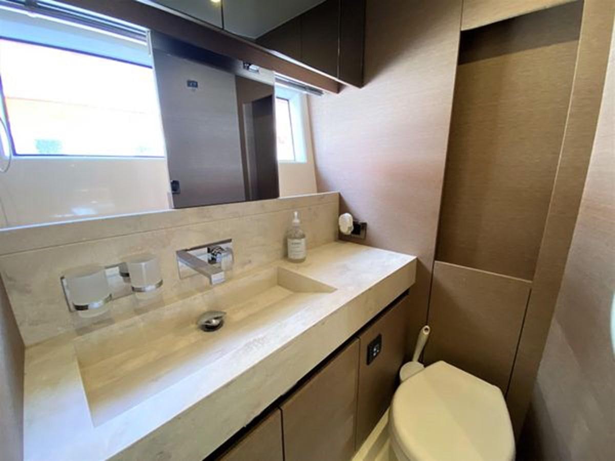 a bathroom with a sink and a toilet aboard 2016 PRESTIGE 680 FLY Yacht for Sale