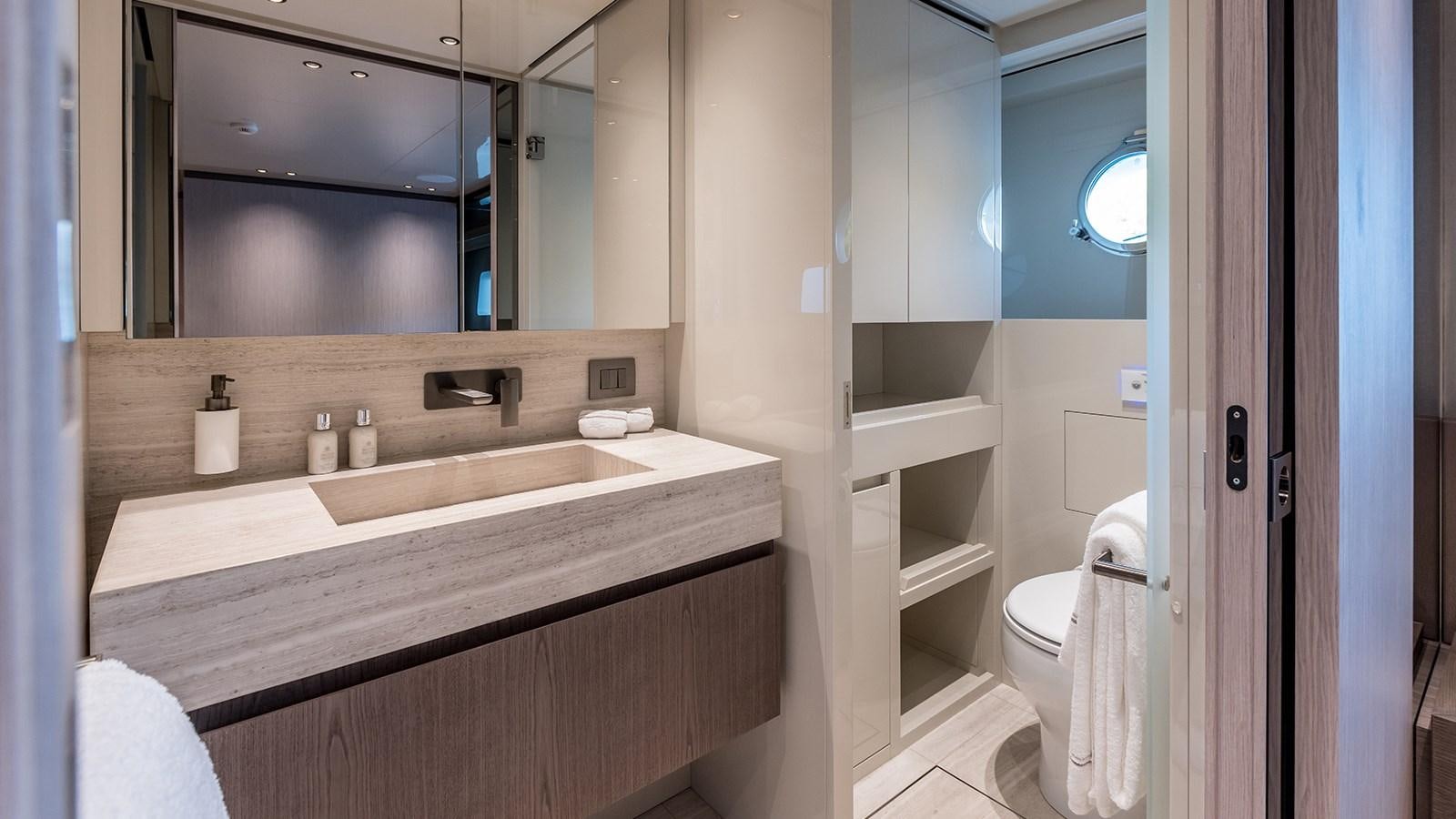 a bathroom with a sink and a mirror aboard ANDIAMO Yacht for Sale