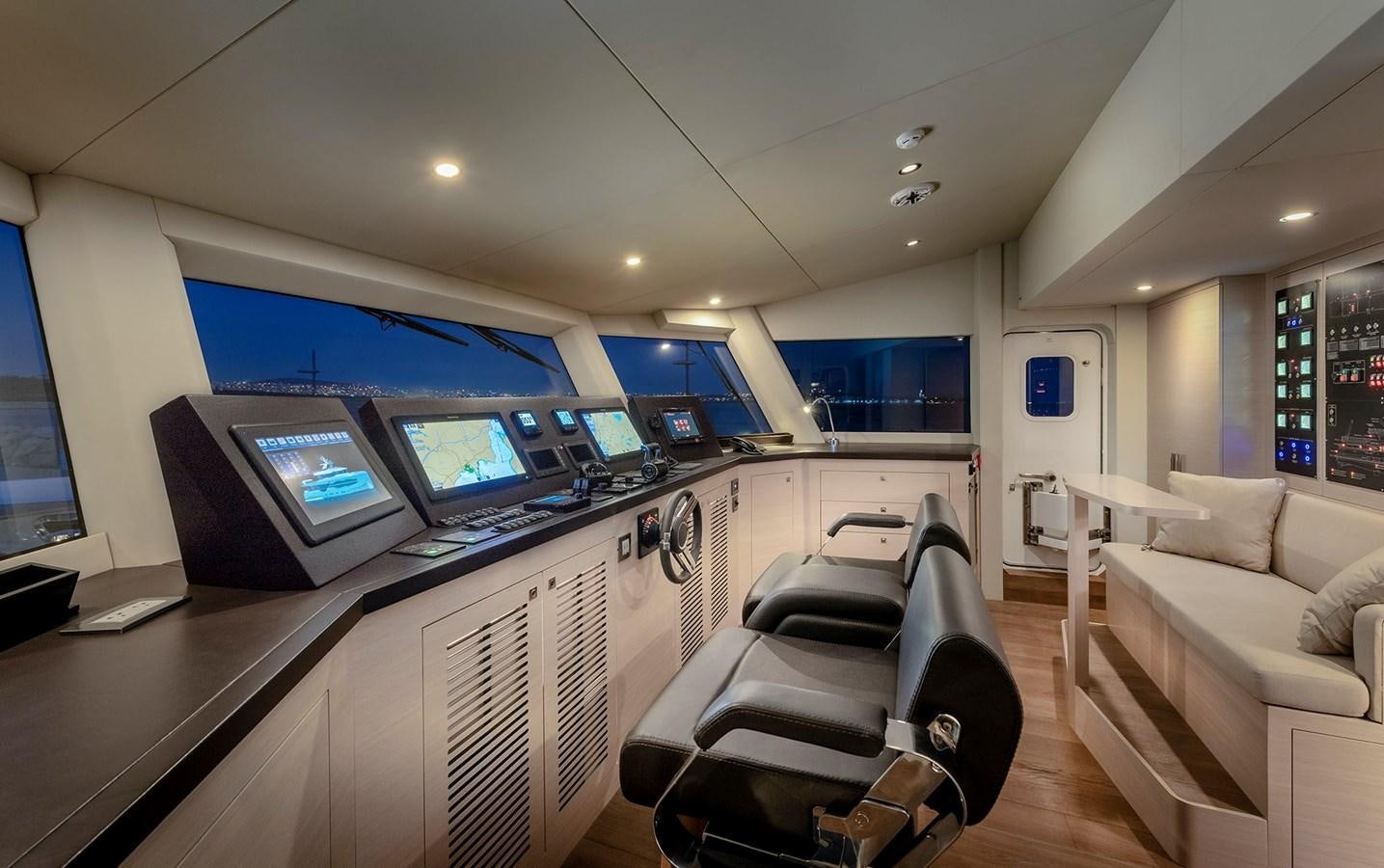 a room with a desk and a couch and a computer aboard PROJECT 105 Yacht for Sale