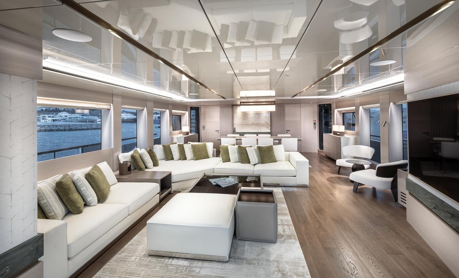 a room with a couch and a table aboard PROJECT 105 Yacht for Sale