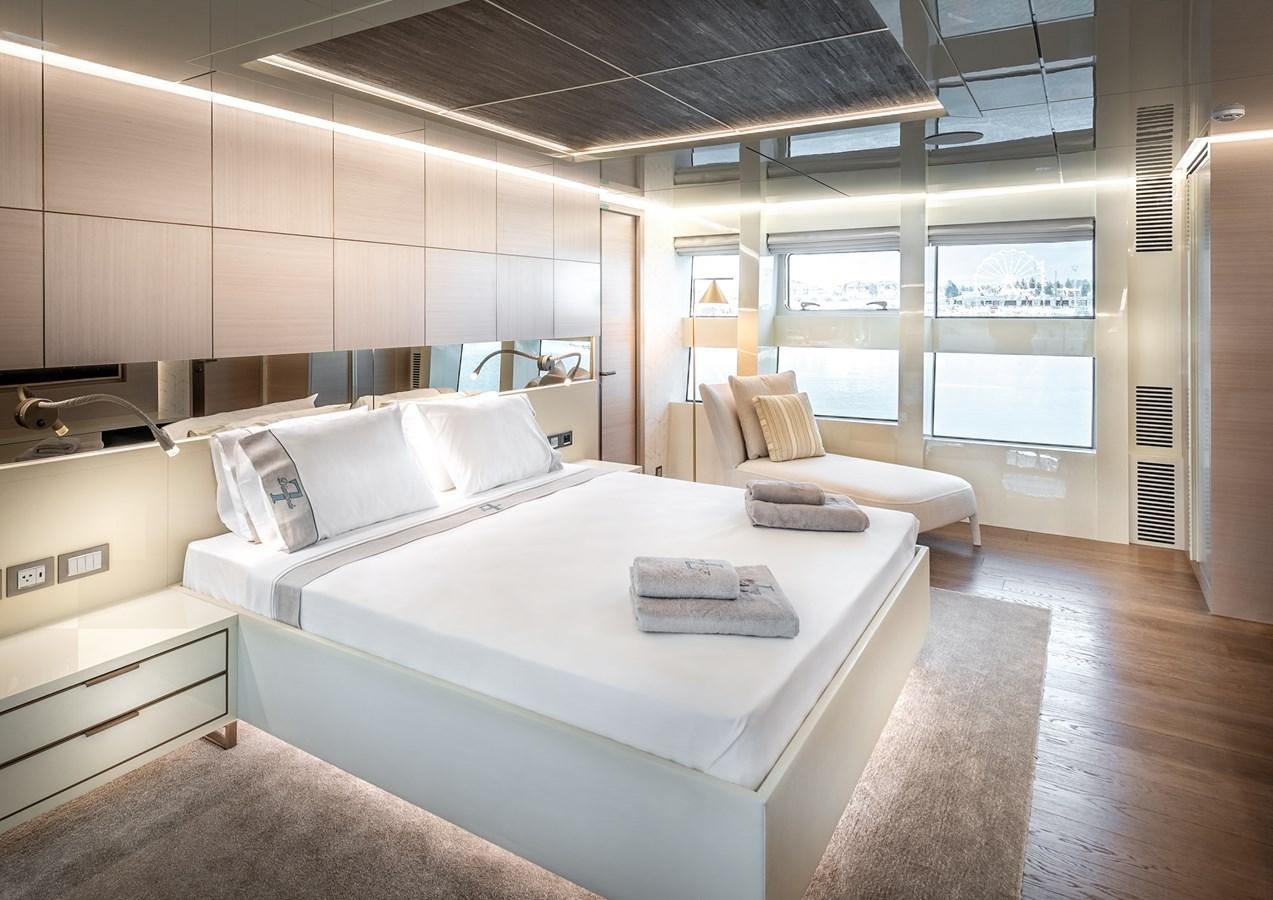 a room with a bed and a desk aboard PROJECT 105 Yacht for Sale