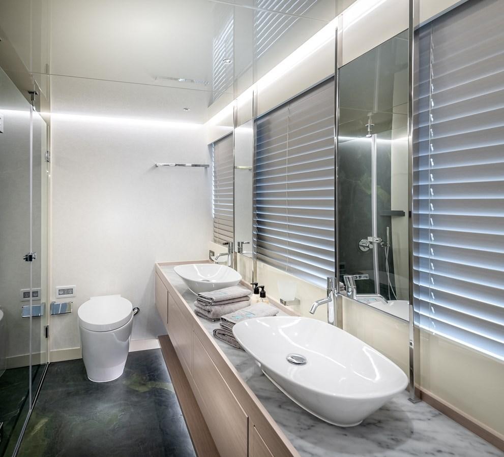 a bathroom with a sink and a mirror aboard PROJECT 105 Yacht for Sale
