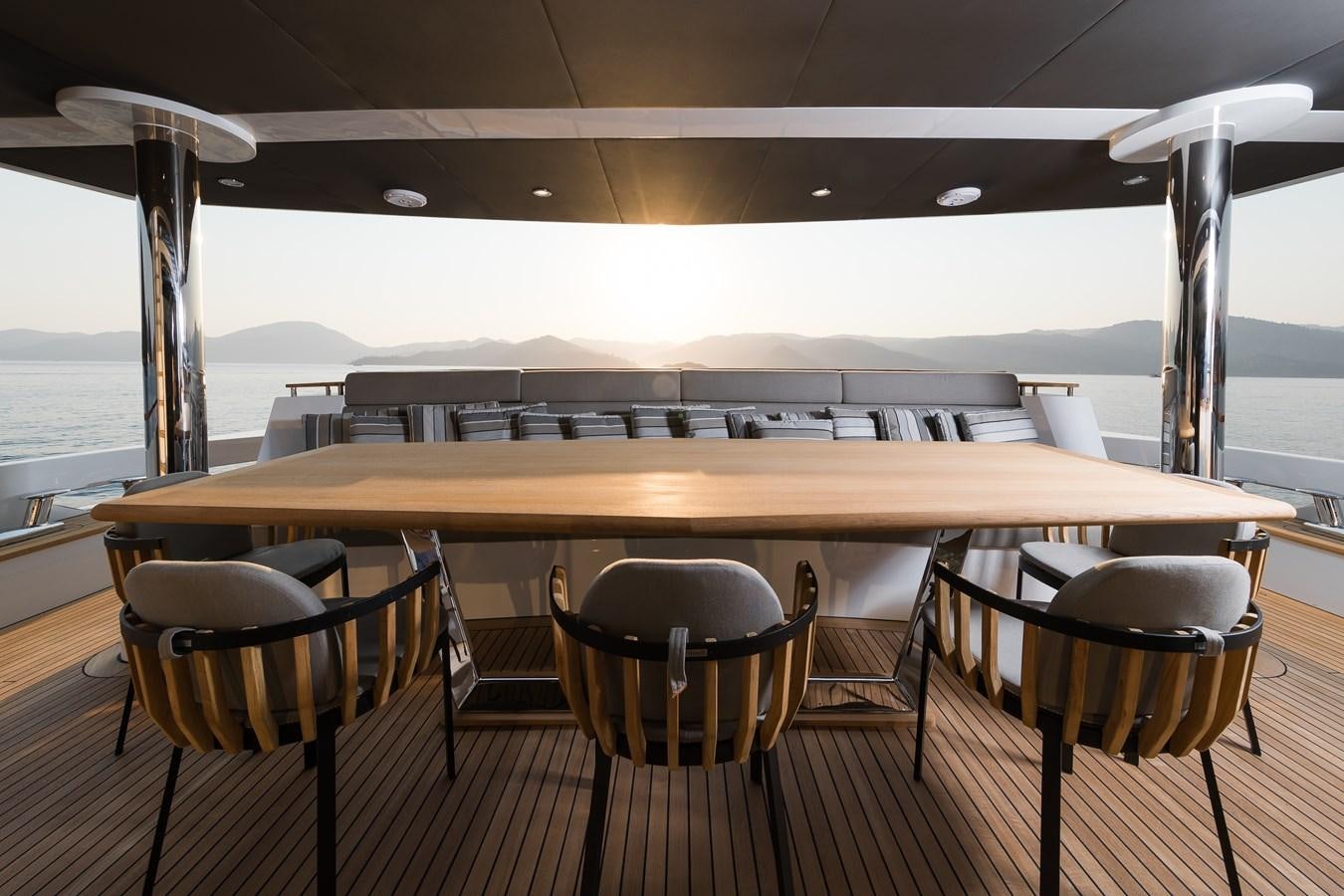 a table with chairs around it aboard PROJECT 105 Yacht for Sale