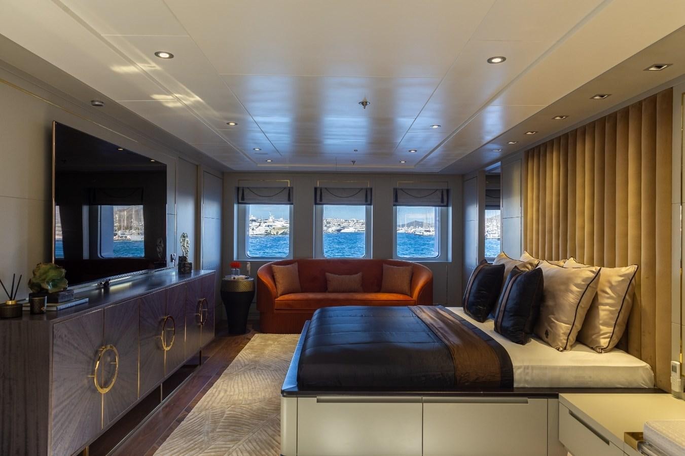a bedroom with a bed and a tv aboard N.M.N Yacht for Sale