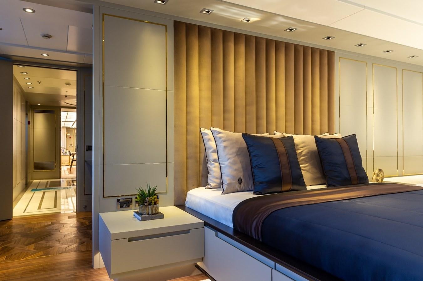 a bed in a room aboard N.M.N Yacht for Sale