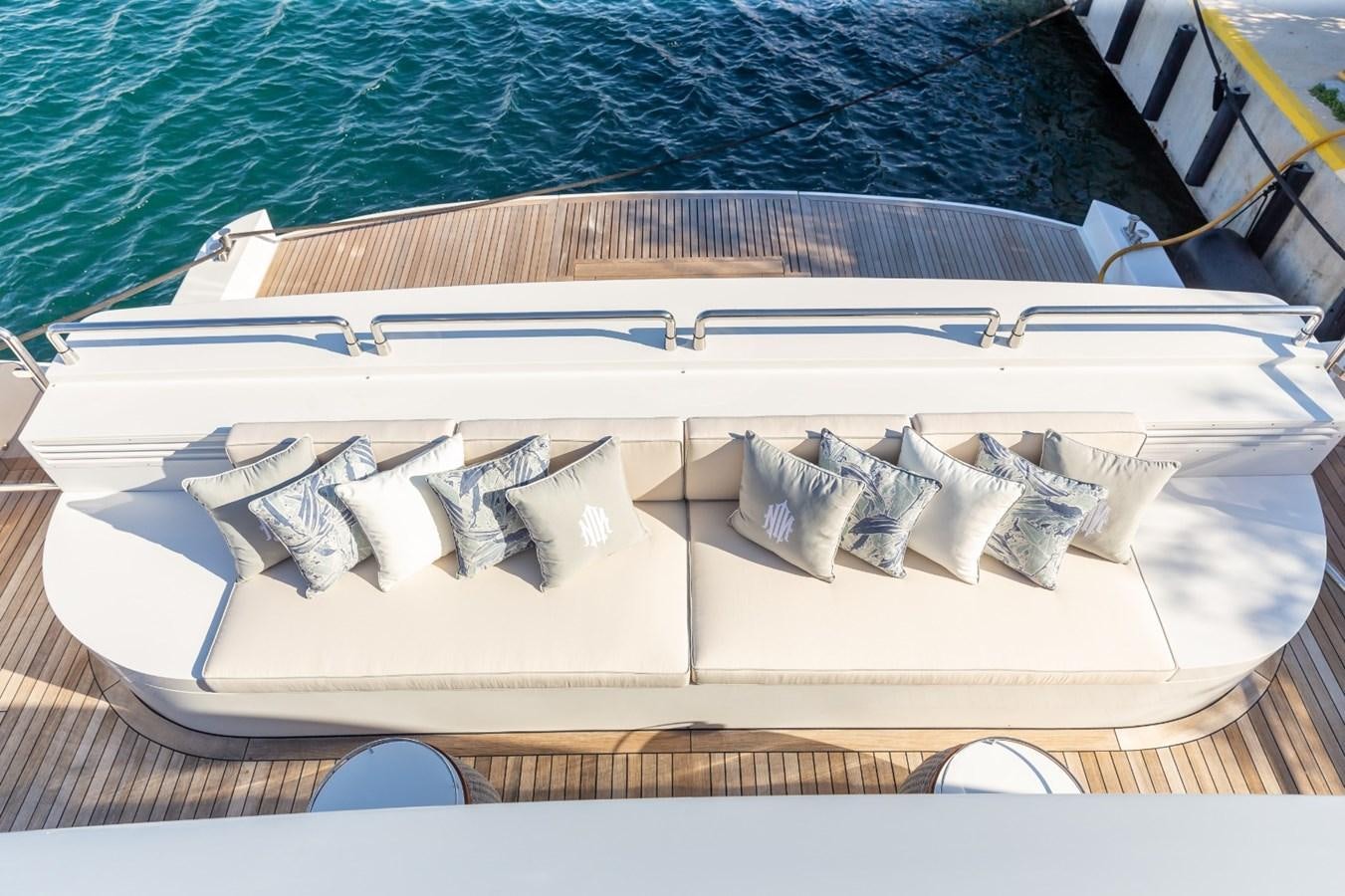 a white boat with white text aboard N.M.N Yacht for Sale