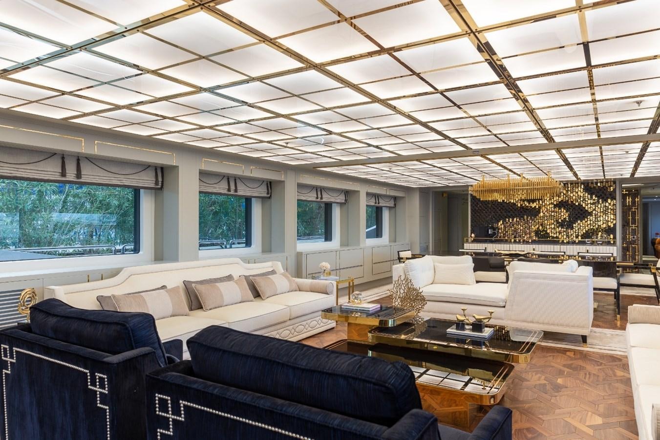 a living room with a large ceiling aboard N.M.N Yacht for Sale