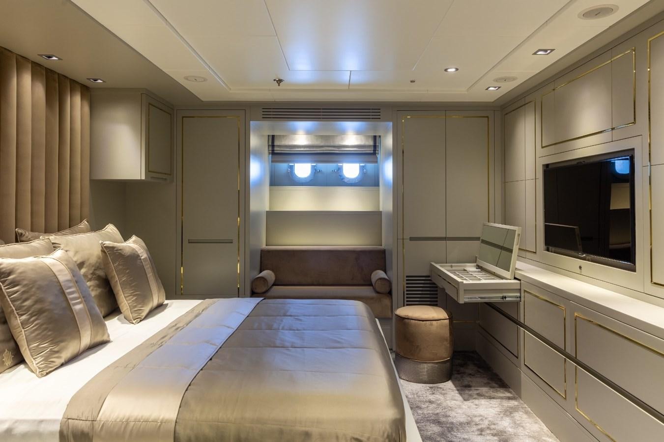 a room with a bed and a desk aboard N.M.N Yacht for Sale
