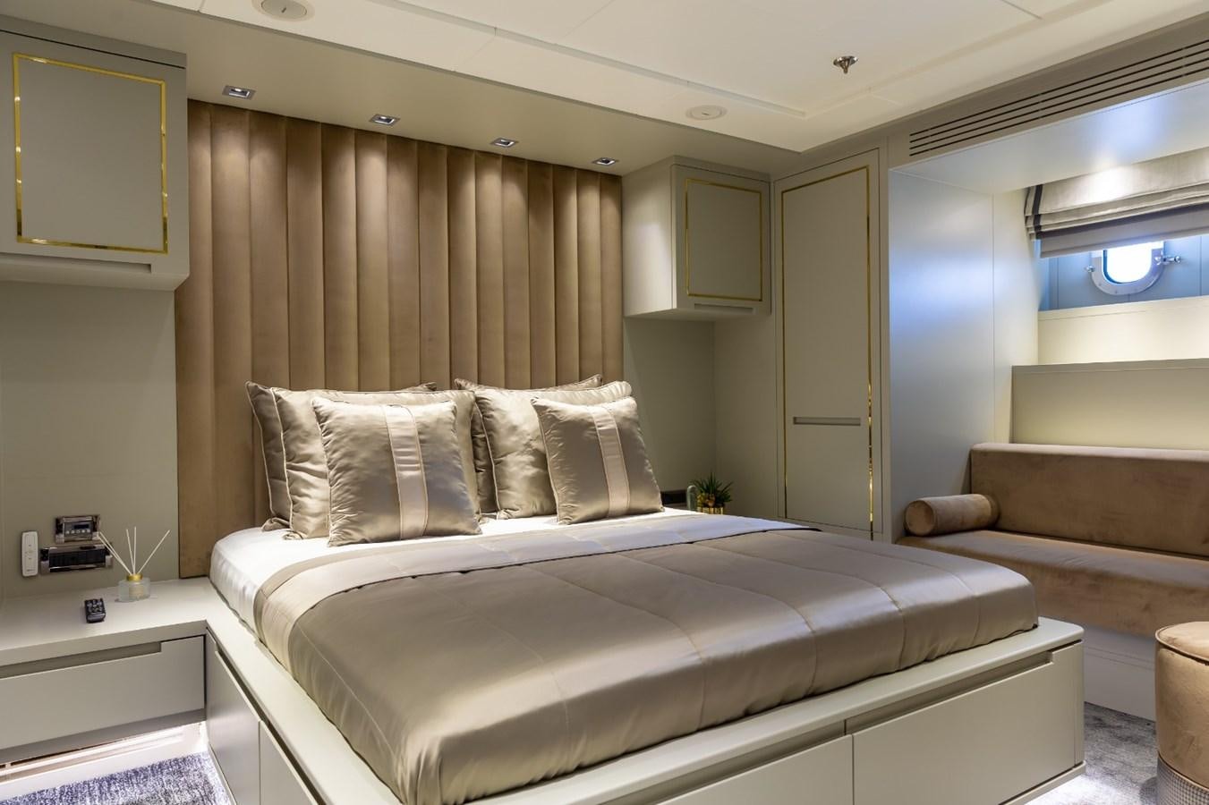 a bed in a room aboard N.M.N Yacht for Sale