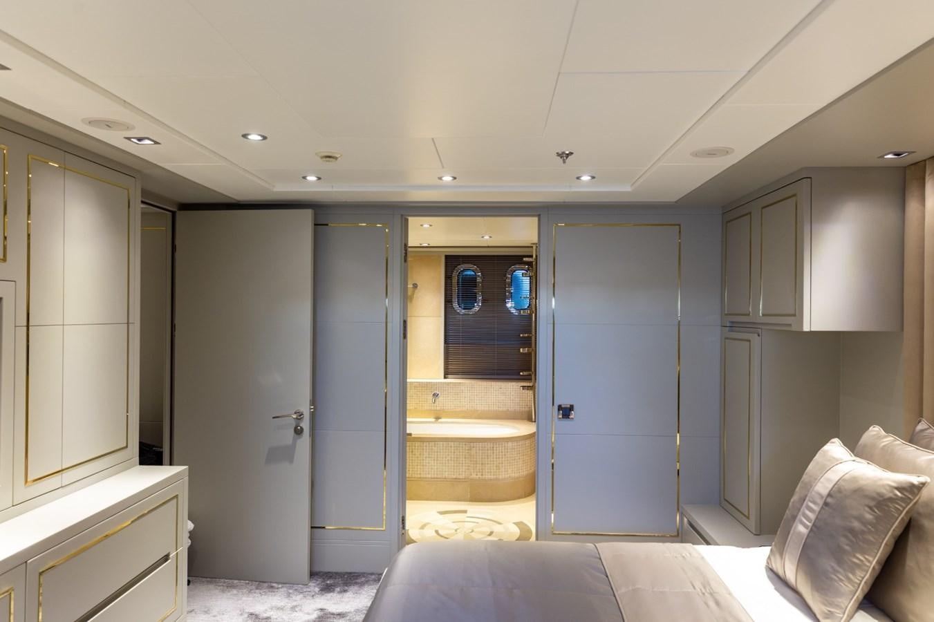 a room with a bed and a door aboard N.M.N Yacht for Sale