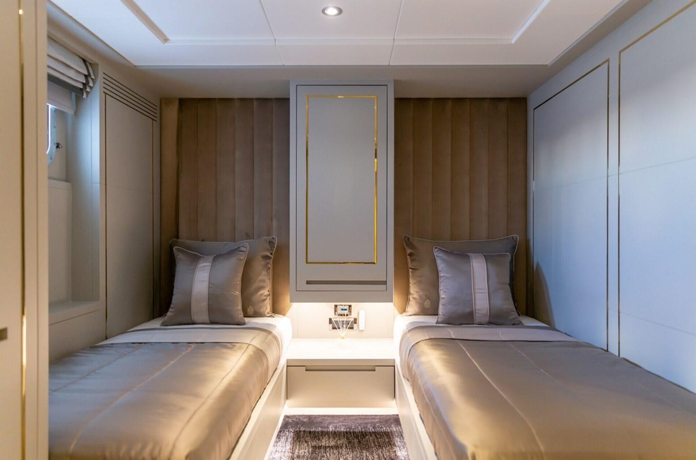 a room with two beds aboard N.M.N Yacht for Sale