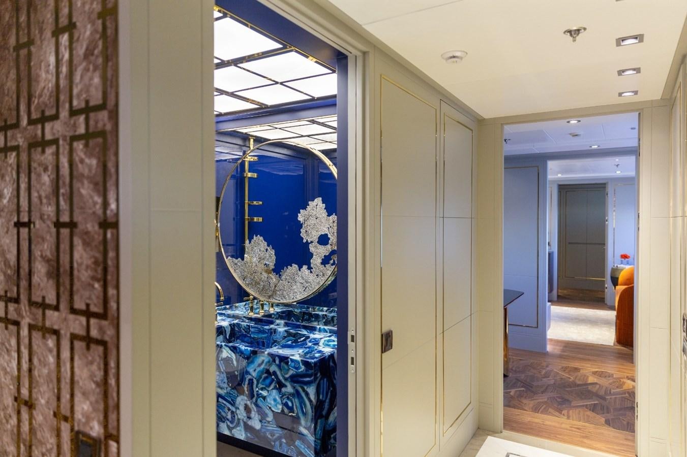 a room with a painting on the wall aboard N.M.N Yacht for Sale