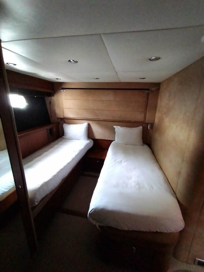 a couple of beds in a room aboard CAPRICHO Yacht for Sale