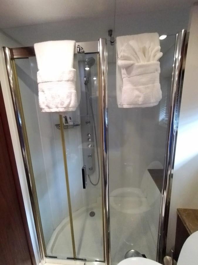 a shower unit with a towel on it aboard CAPRICHO Yacht for Sale