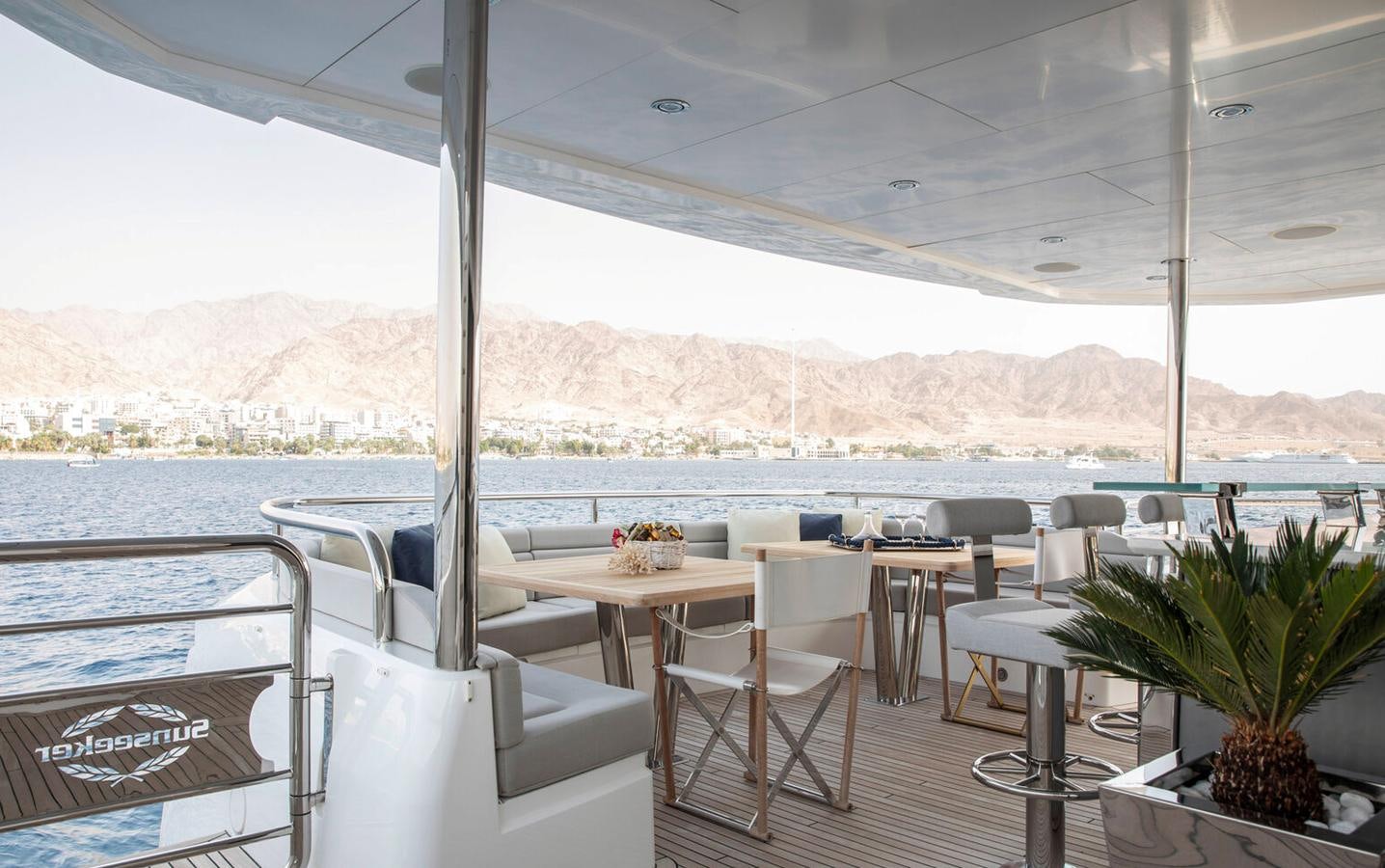a room with a table and chairs aboard 2018 SUNSEEKER 116 Yacht for Sale