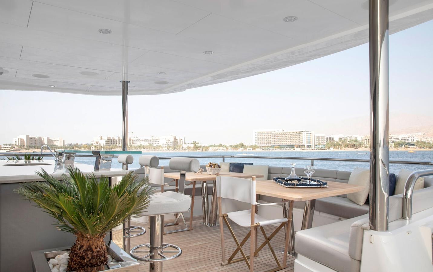 a room with tables and chairs aboard 2018 SUNSEEKER 116 Yacht for Sale