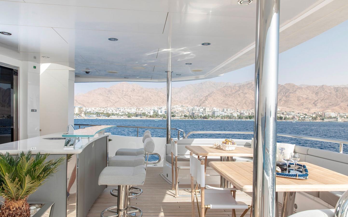 a room with tables and chairs aboard 2018 SUNSEEKER 116 Yacht for Sale