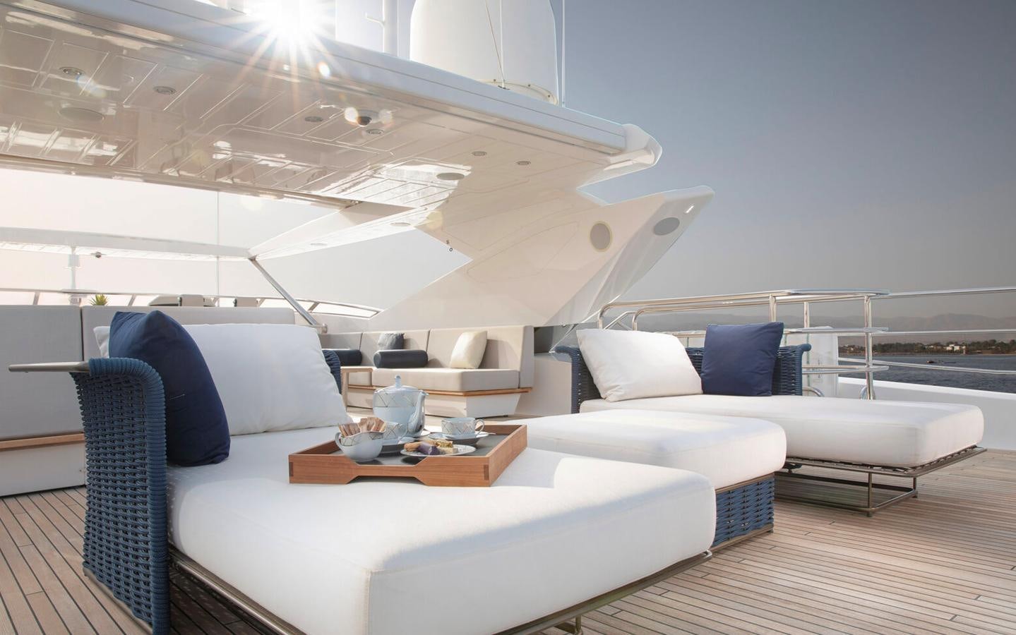 a room with a couch and a table aboard 2018 SUNSEEKER 116 Yacht for Sale