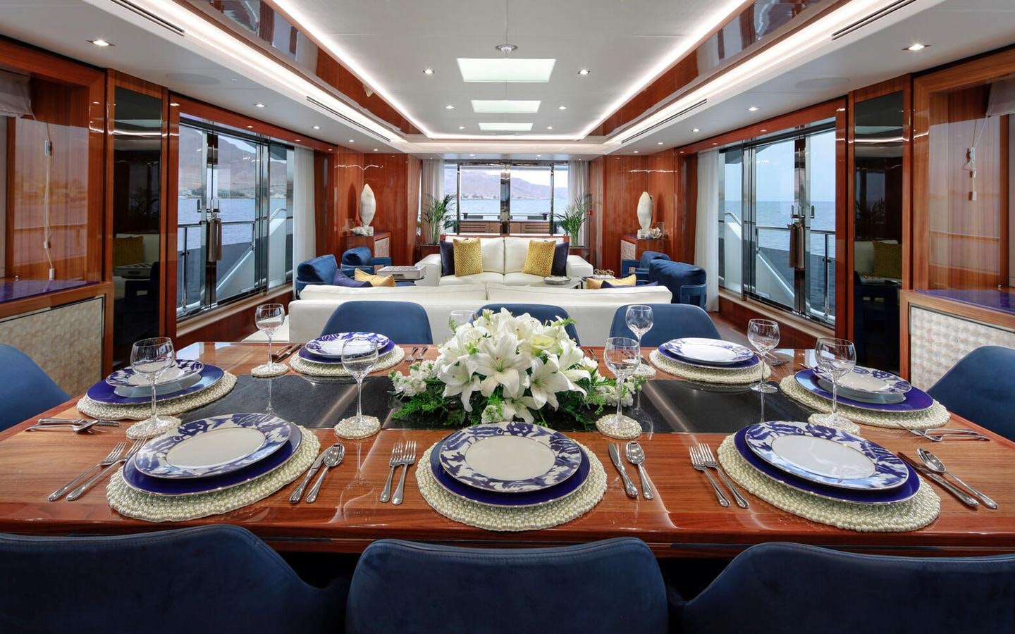 a dining room with a table set aboard 2018 SUNSEEKER 116 Yacht for Sale