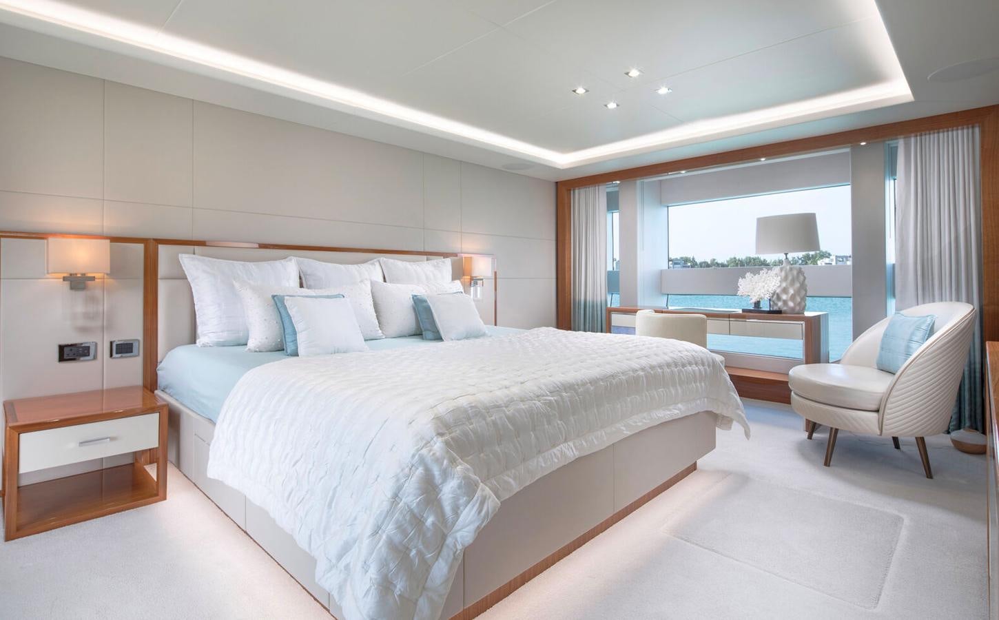 a large bed in a hotel room aboard 2018 SUNSEEKER 116 Yacht for Sale