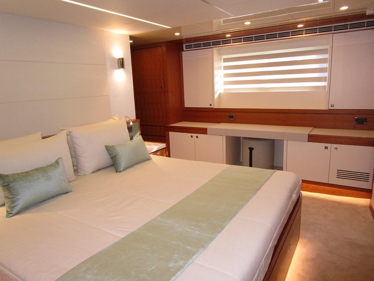 a bed in a room aboard JOHNSON 83 SKYLOUNGE Yacht for Sale