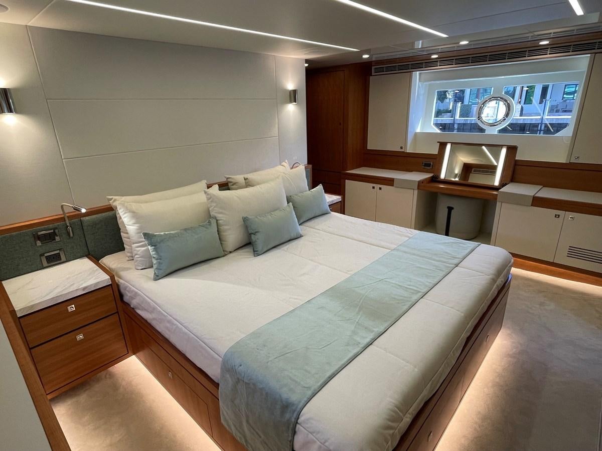 a bed in a room aboard JOHNSON 83 SKYLOUNGE Yacht for Sale