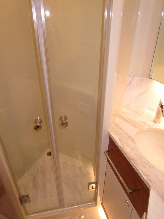 a shower unit in a bathroom aboard JOHNSON 83 SKYLOUNGE Yacht for Sale