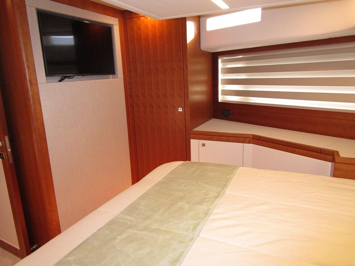 a bed in a room aboard JOHNSON 83 SKYLOUNGE Yacht for Sale