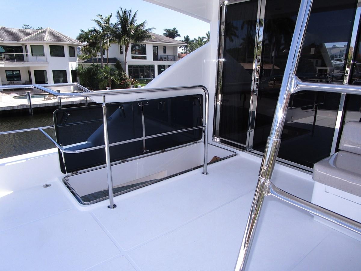 a deck with a pool aboard JOHNSON 83 SKYLOUNGE Yacht for Sale
