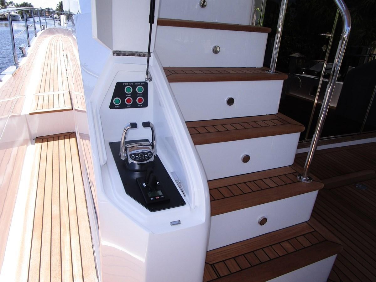 a white machine with a screen aboard JOHNSON 83 SKYLOUNGE Yacht for Sale