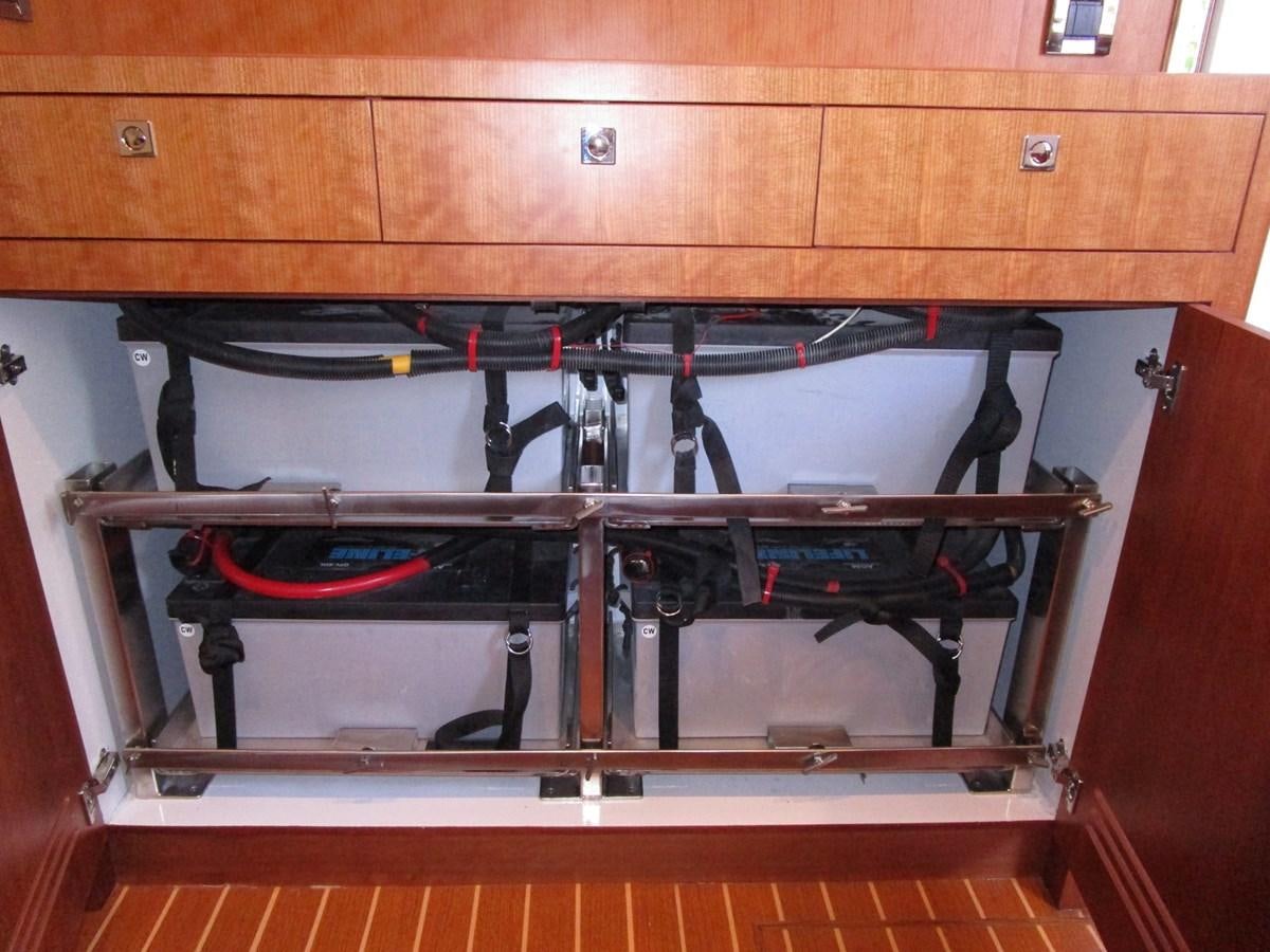 a shelf with a variety of tools aboard JOHNSON 83 SKYLOUNGE Yacht for Sale