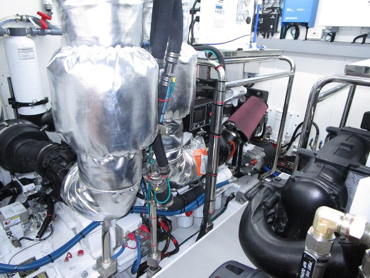 a machine with a large metal cylinder aboard JOHNSON 83 SKYLOUNGE Yacht for Sale