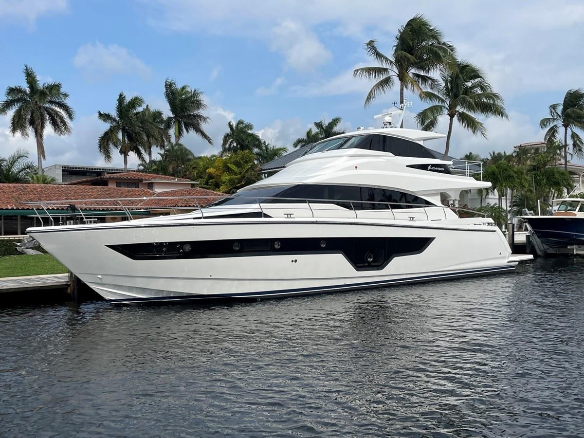 a white yacht docked aboard JOHNSON 83 SKYLOUNGE Yacht for Sale