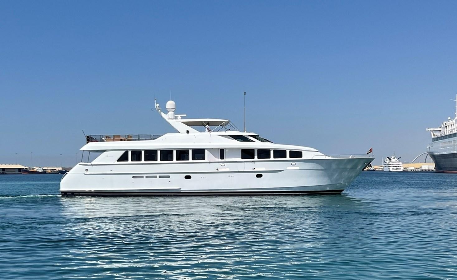 a white yacht in the water aboard 1998 HATTERAS 92 Yacht for Sale