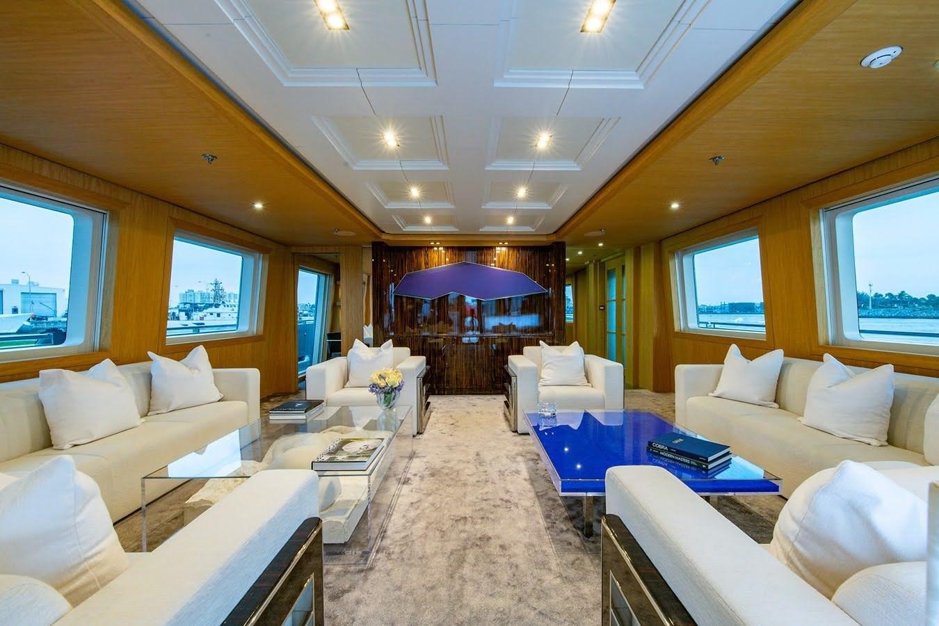 a living room with a couch and a table aboard MIZU Yacht for Sale