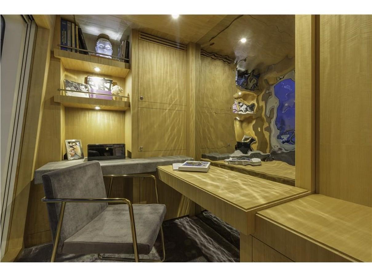a room with a desk and a chair aboard MIZU Yacht for Sale