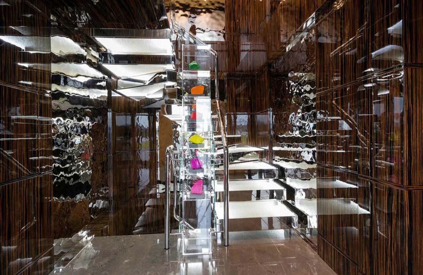 a room with a large glass display aboard MIZU Yacht for Sale