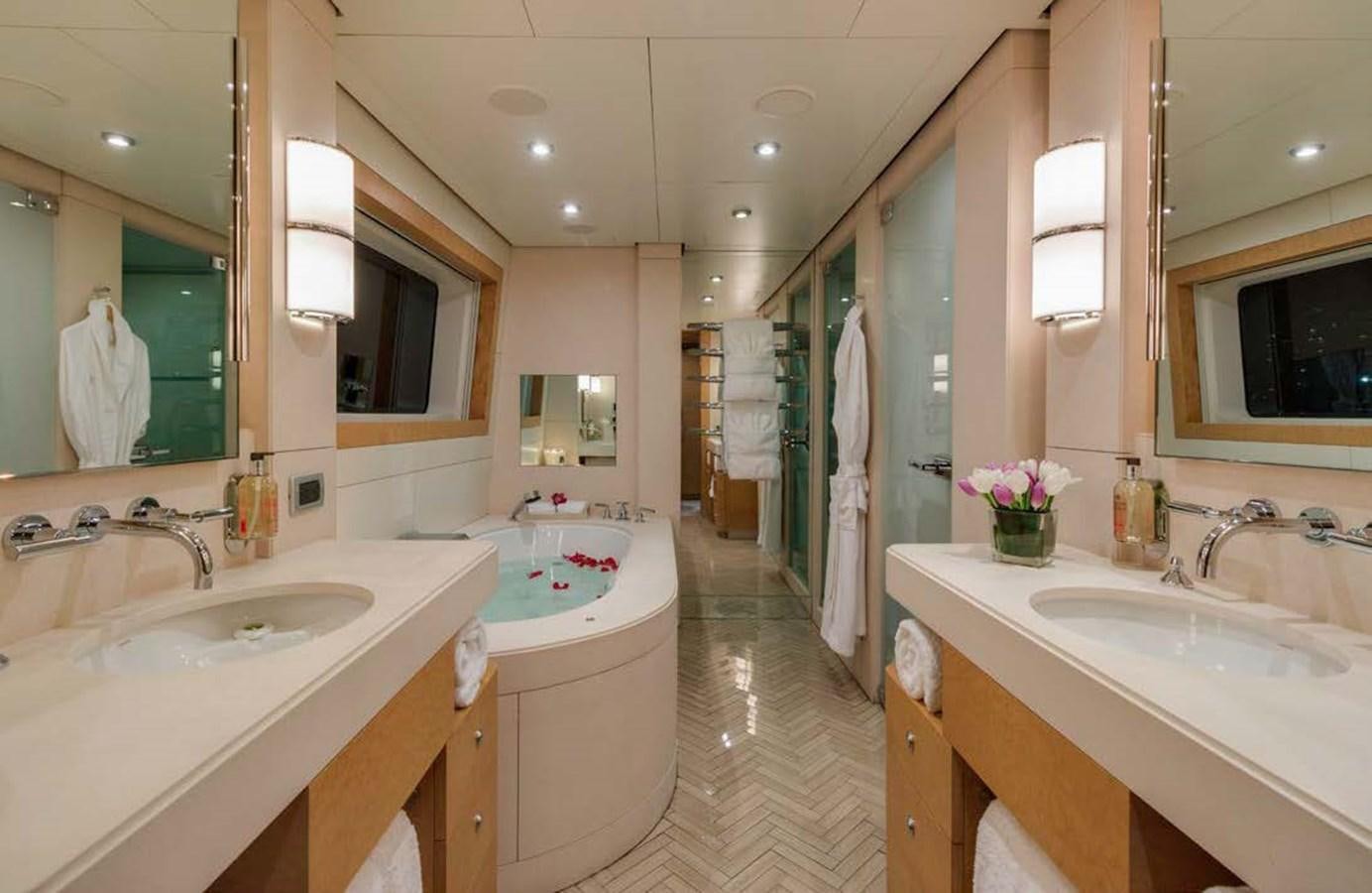 a bathroom with a tub sink and sinks aboard MIZU Yacht for Sale