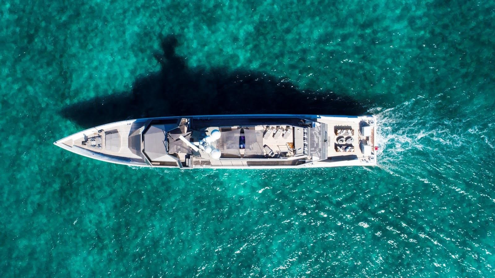 a helicopter flying over a body of water aboard MIZU Yacht for Sale