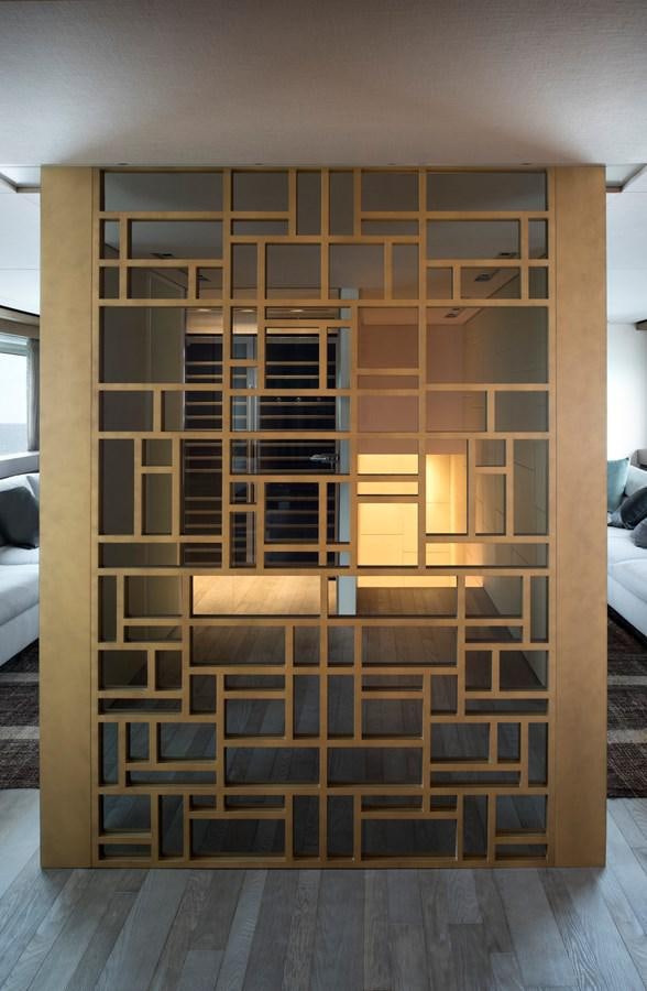 a room with a large wooden shelving unit aboard ALEGRIA Y Yacht for Sale