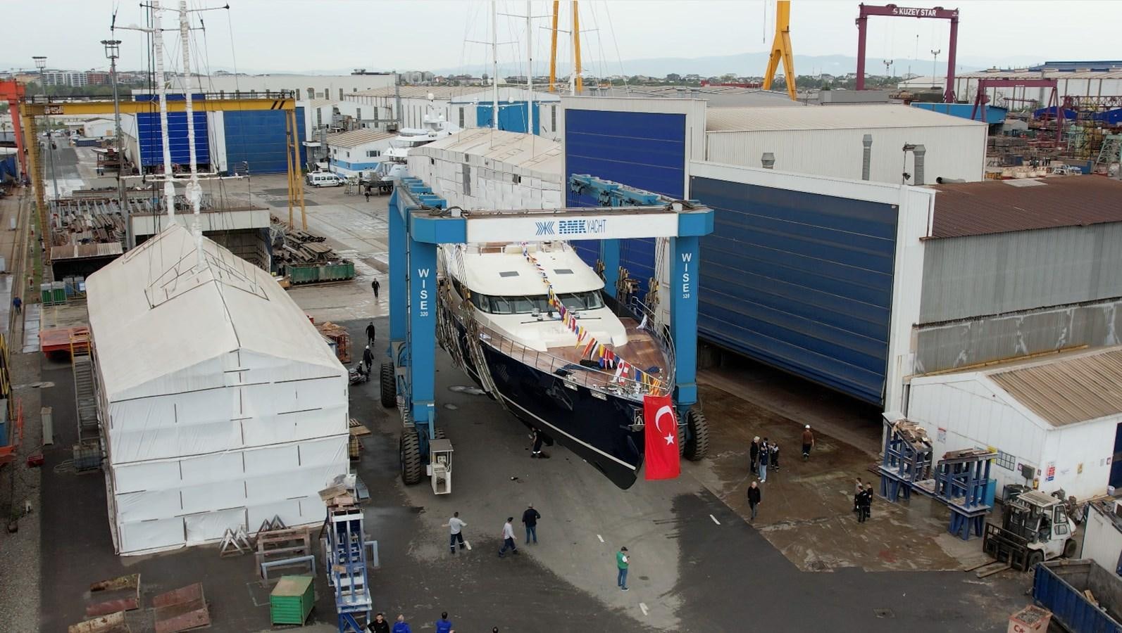a large white boat in a dock aboard LEGATO Yacht for Sale