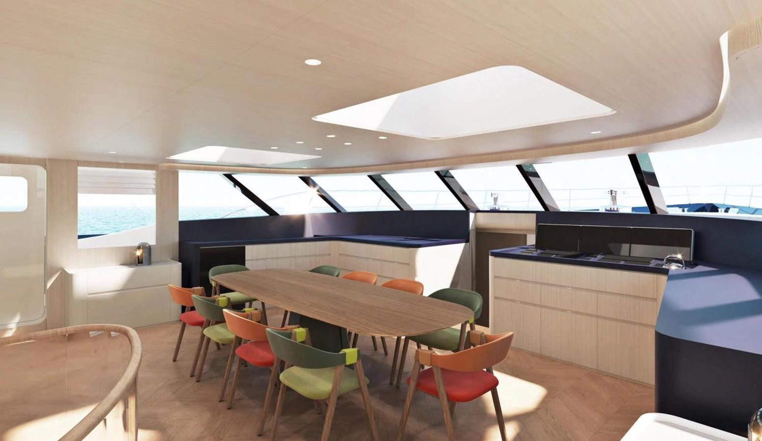 a room with tables and chairs aboard LEGATO Yacht for Sale