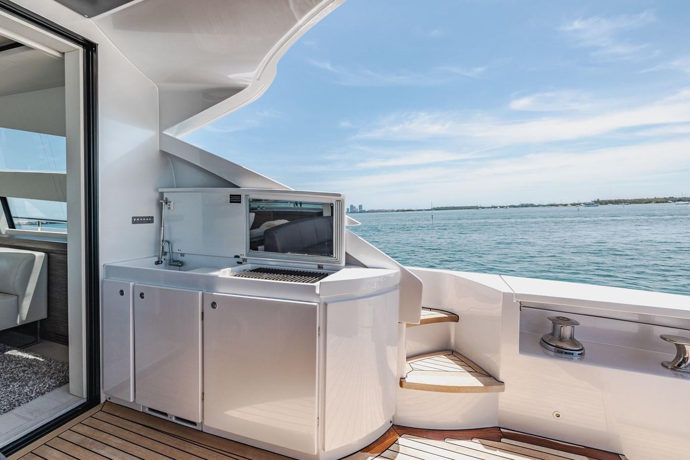 a room with a microwave oven and a chair aboard DOUBLE OR NOTHING Yacht for Sale