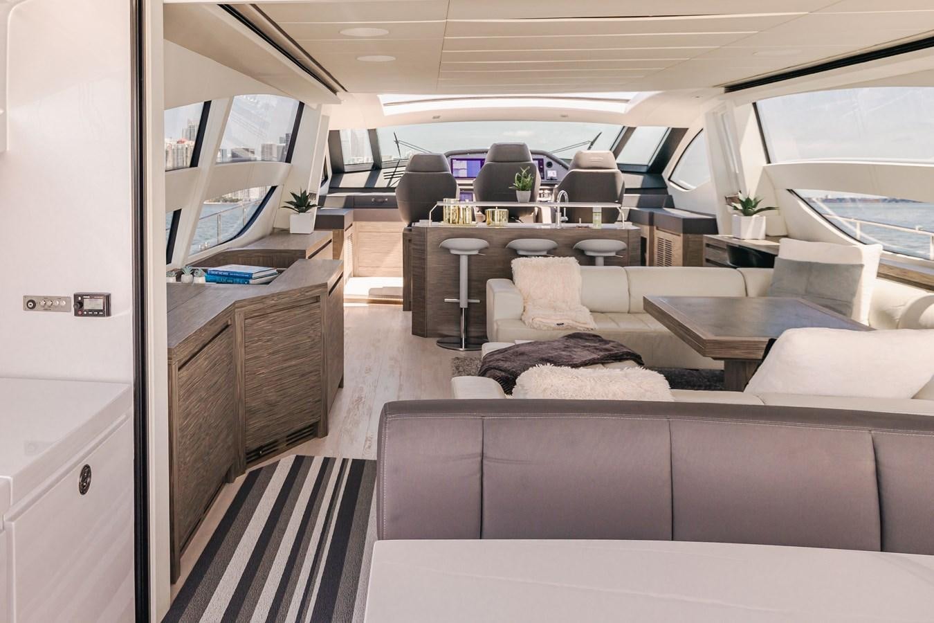 a room with a couch and a table aboard DOUBLE OR NOTHING Yacht for Sale