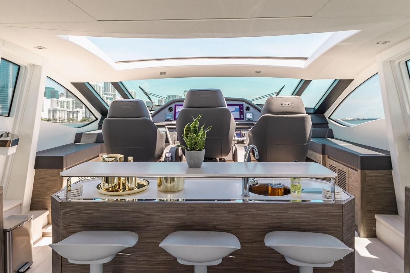 a table with chairs and a couch aboard DOUBLE OR NOTHING Yacht for Sale