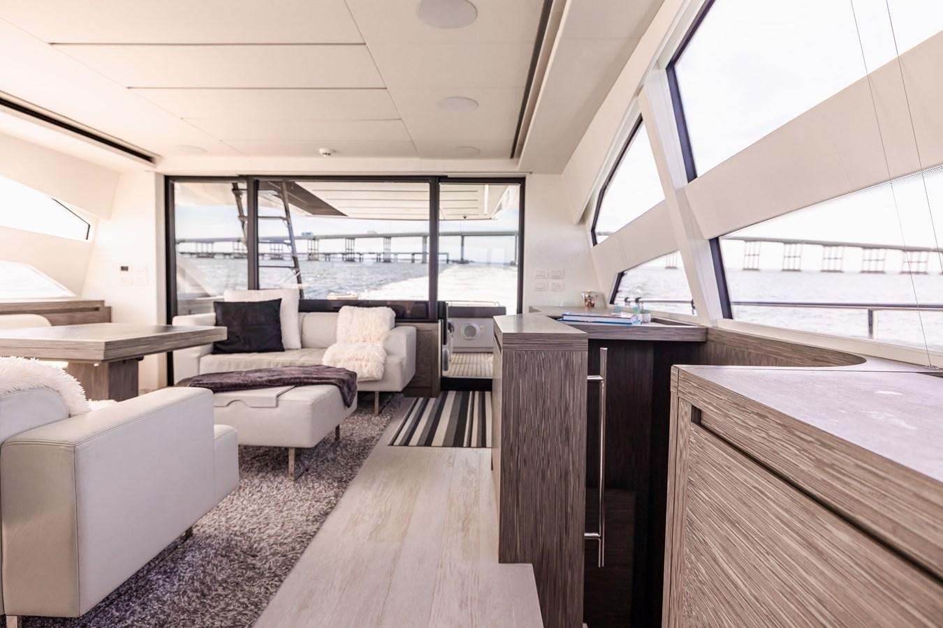 a room with a couch and a table aboard DOUBLE OR NOTHING Yacht for Sale