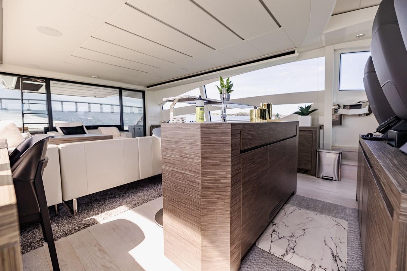 a room with a large table and chairs aboard DOUBLE OR NOTHING Yacht for Sale