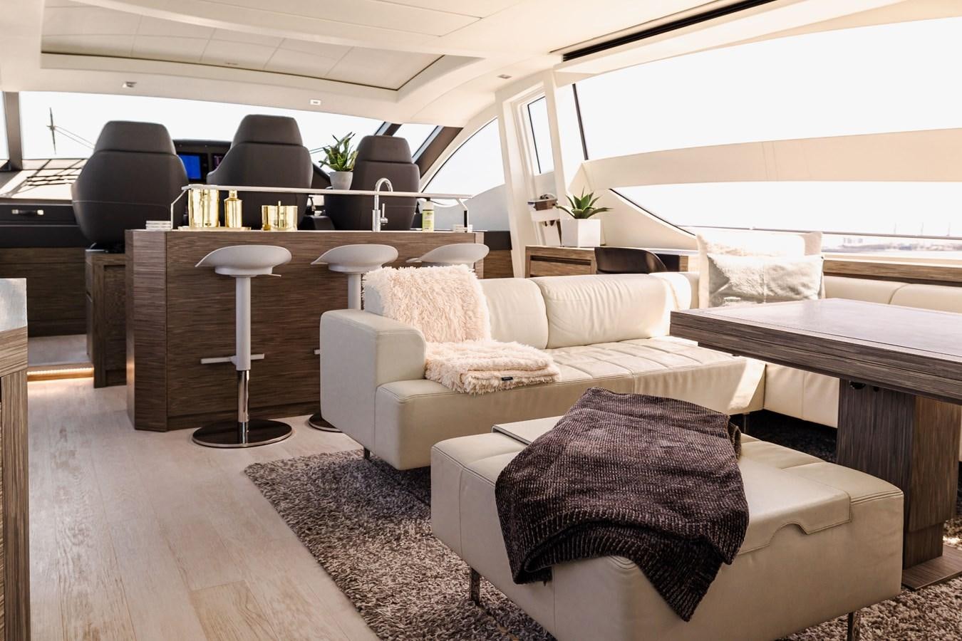 a room with couches and a table aboard DOUBLE OR NOTHING Yacht for Sale